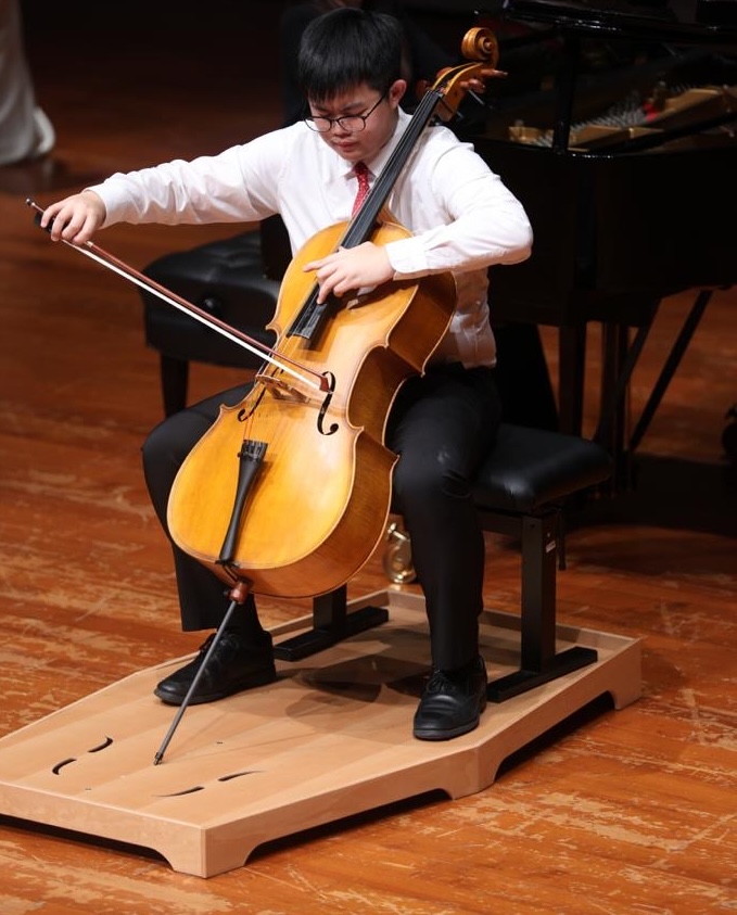 Trevor Chan performing cello with piano accompaniment